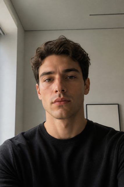 Sample photo before styling: plain black tee, flat indoor light.